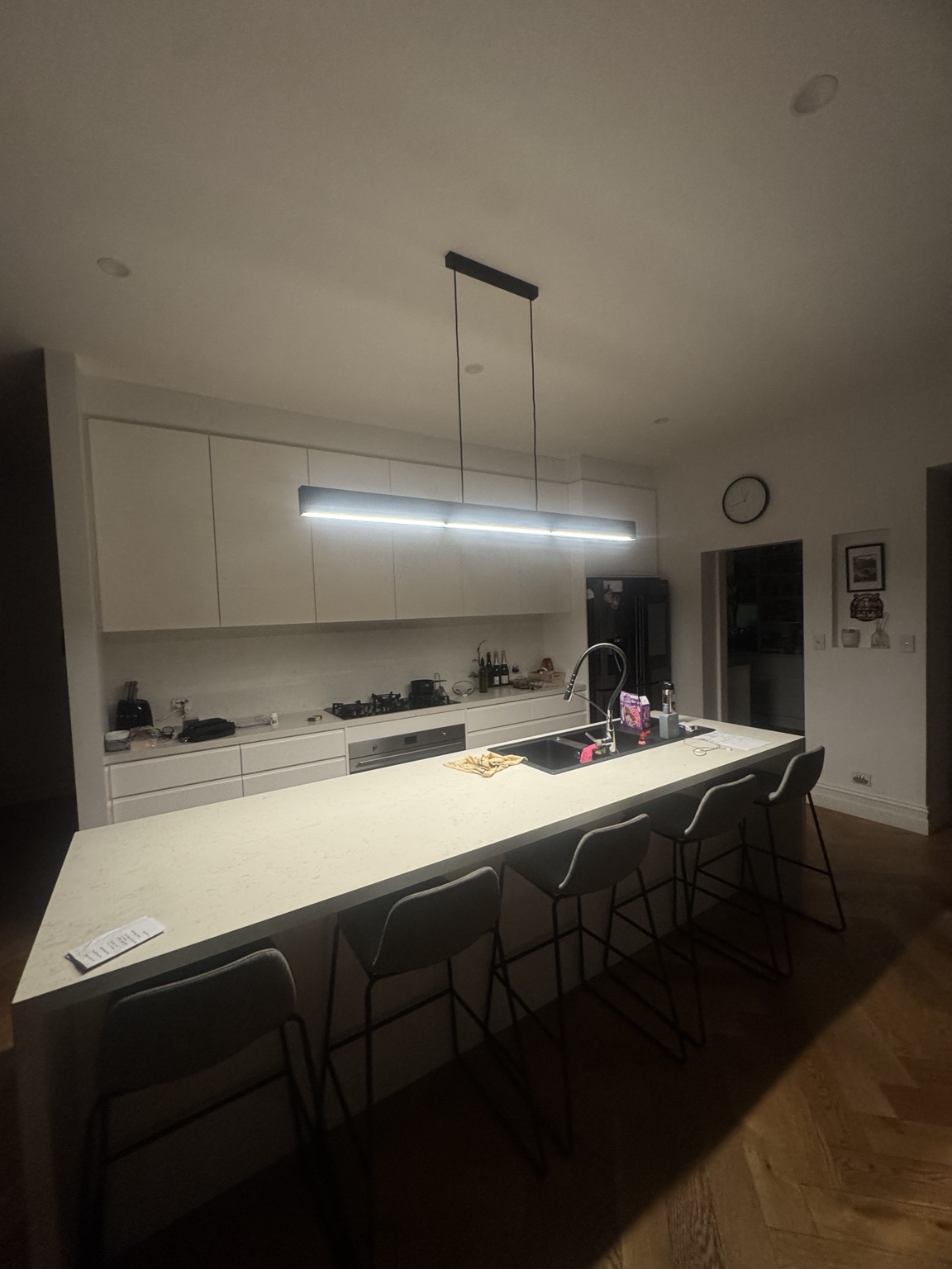 Linear pendant over kitchen island